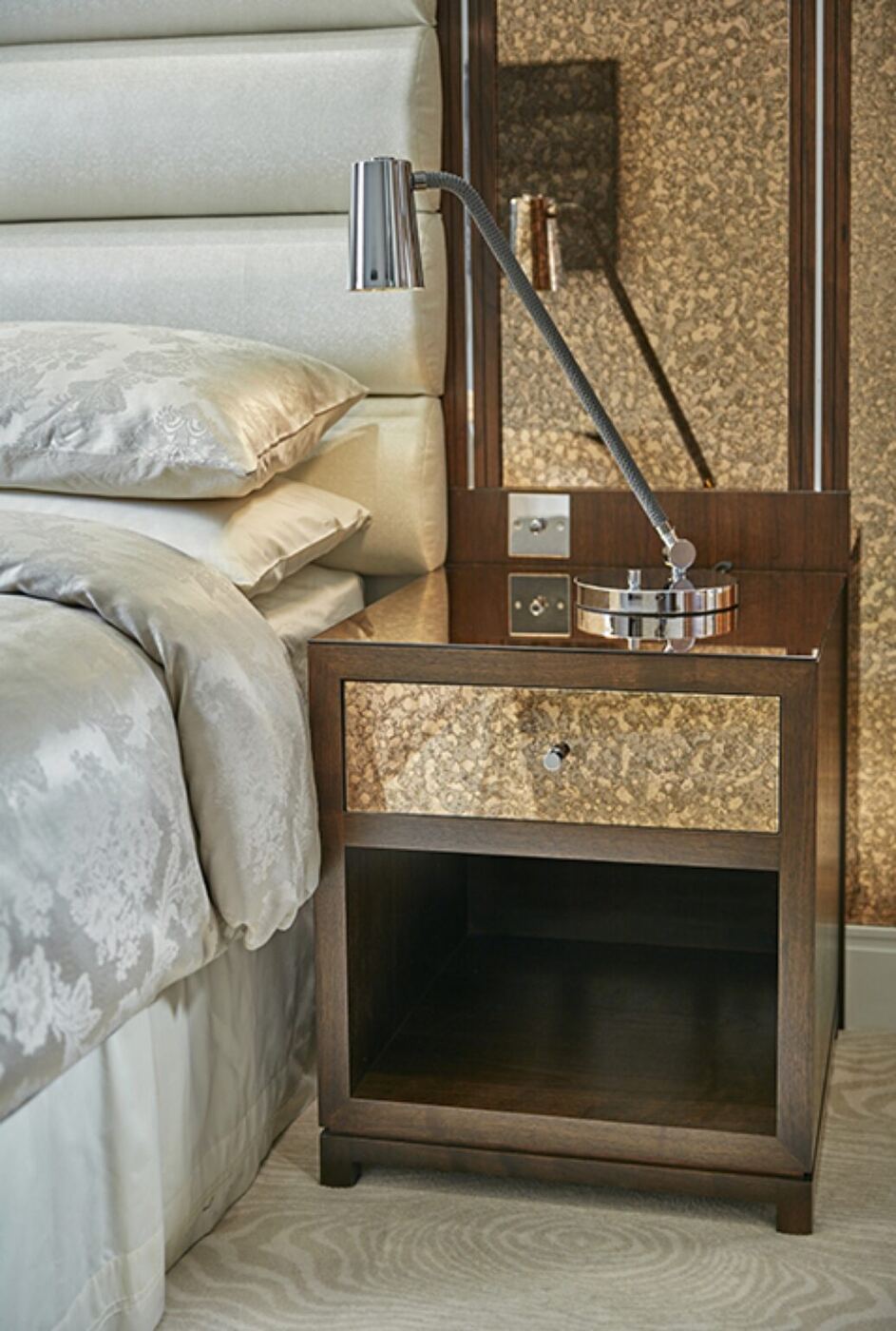 This bronzed antiqued glass featured throughout a West London Townhouse