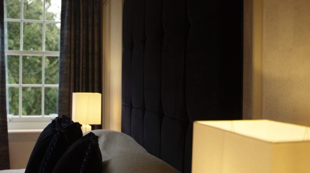A blue velvet fitted headboard