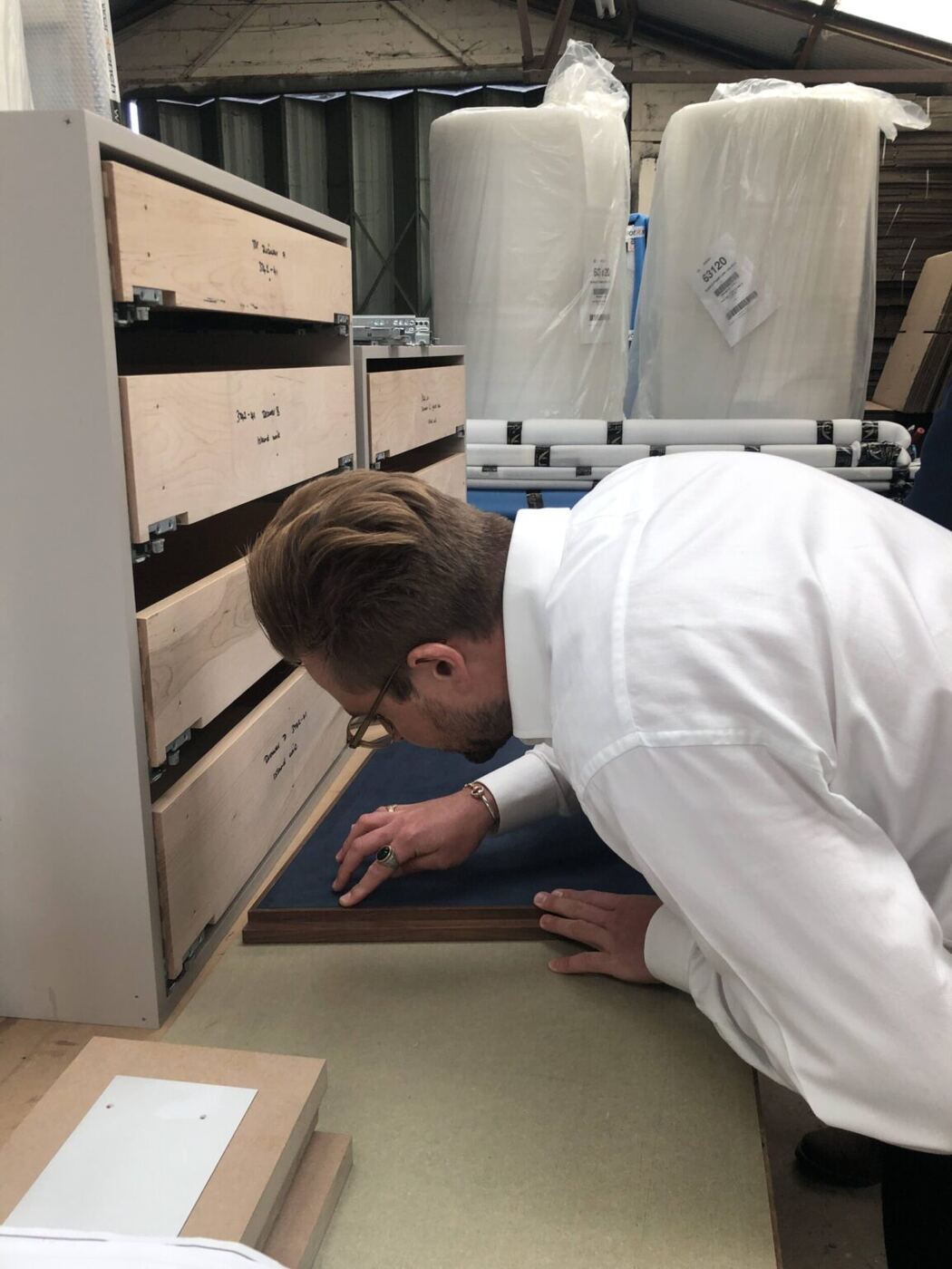Inspecting the sided dressing table in the workshop