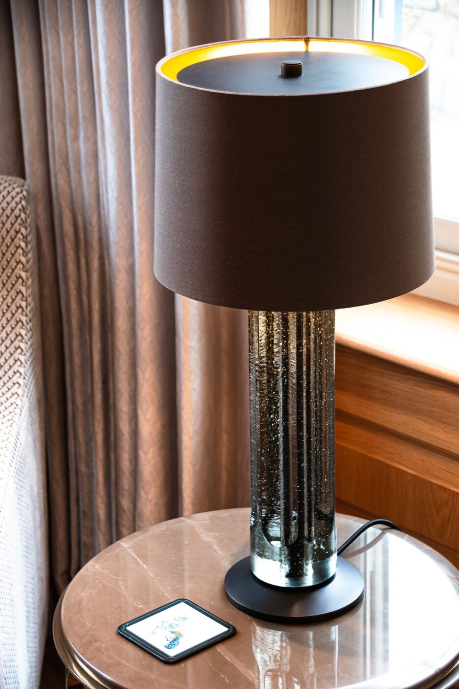 The study features a beautiful Sea Glass lamp designed by Holly Hunt